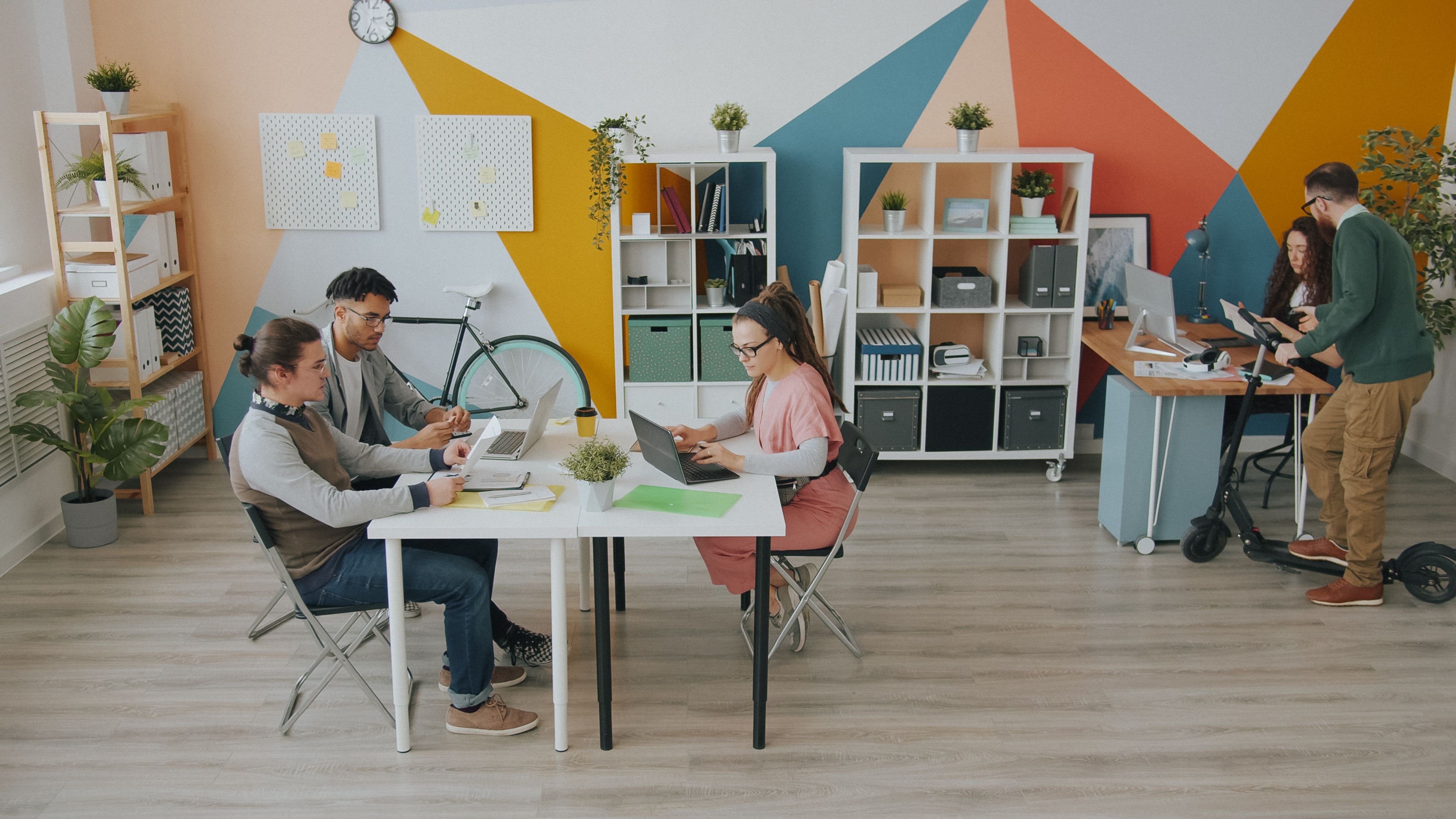 A creative team collaborating in a bright studio