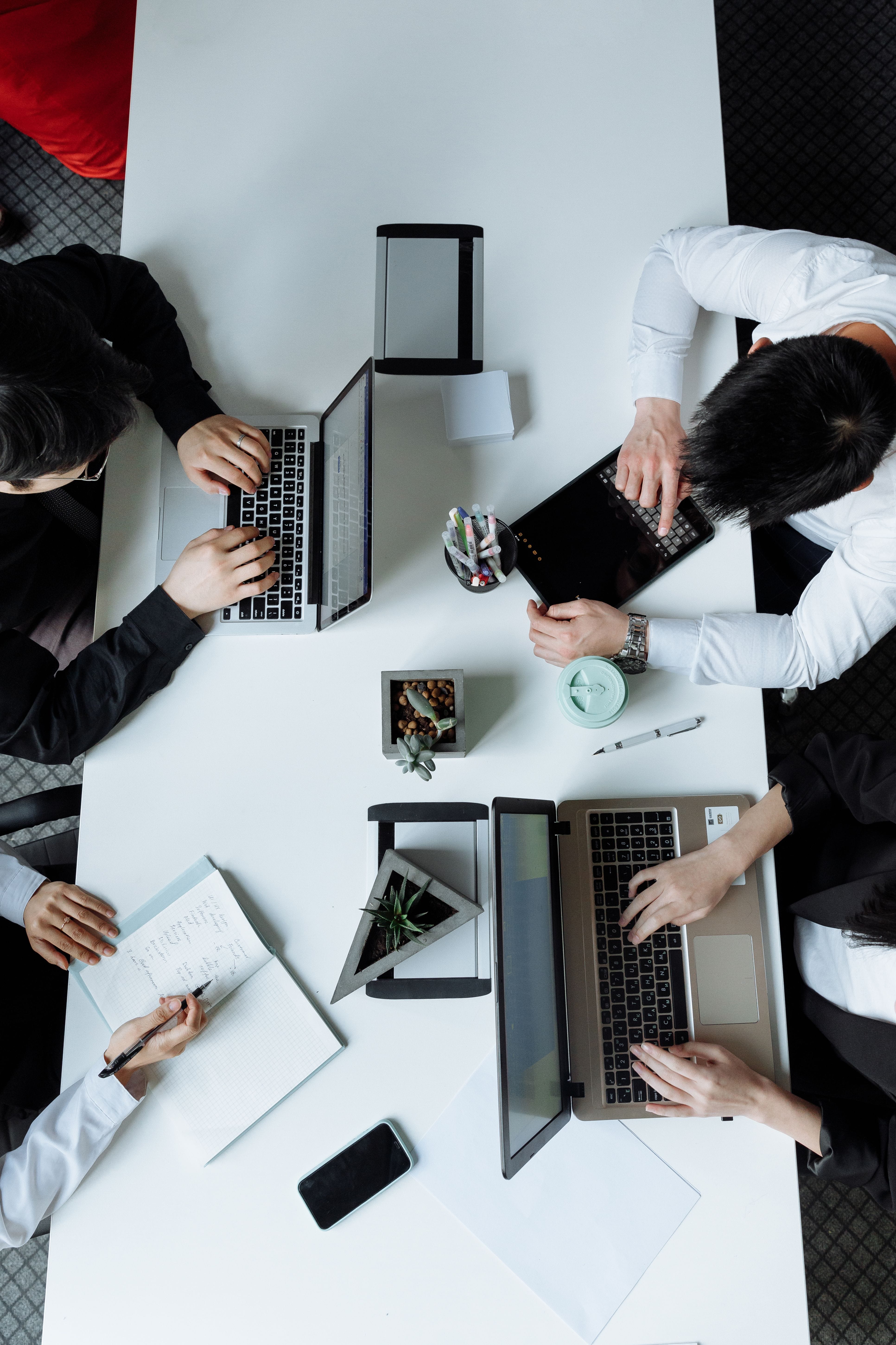 Colleagues planning around a shared table